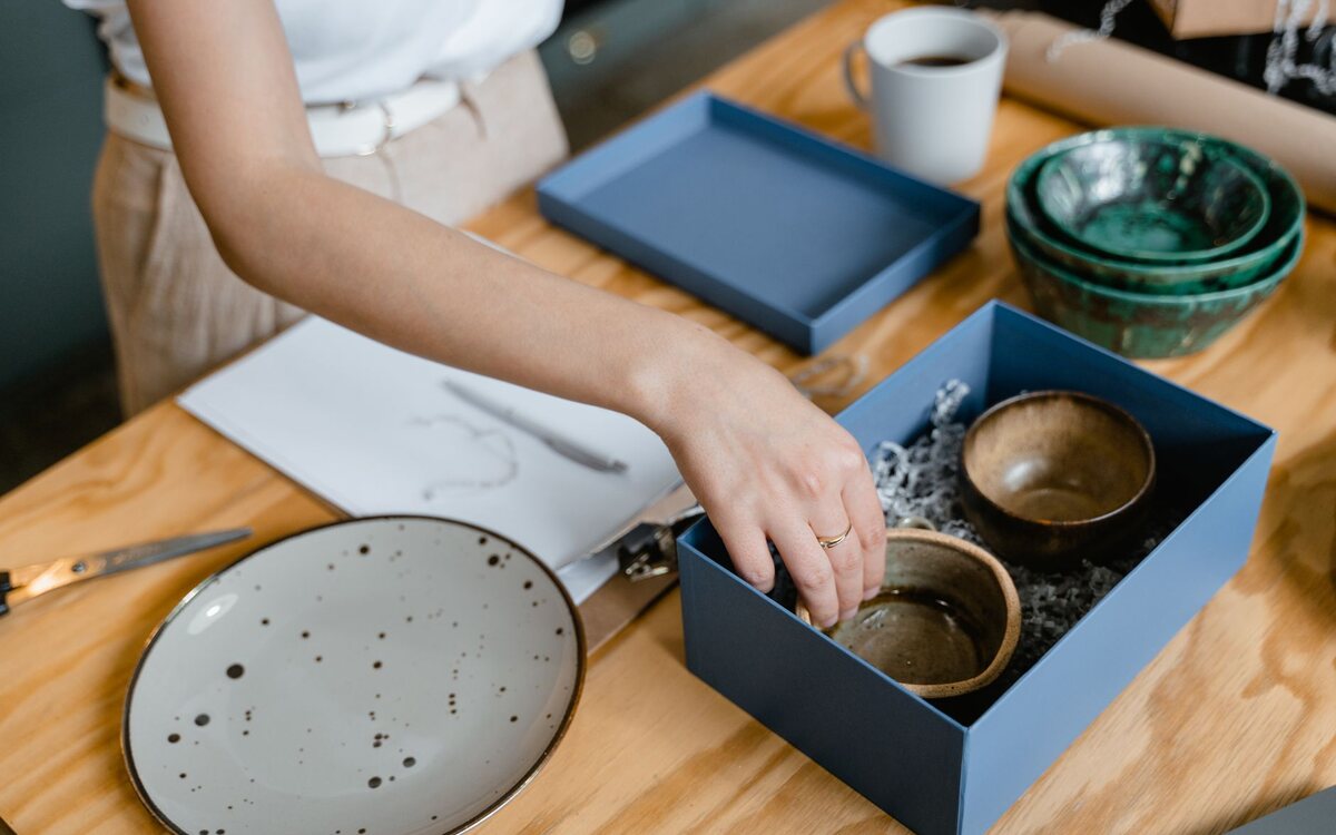 Small business owner packing products for shipping